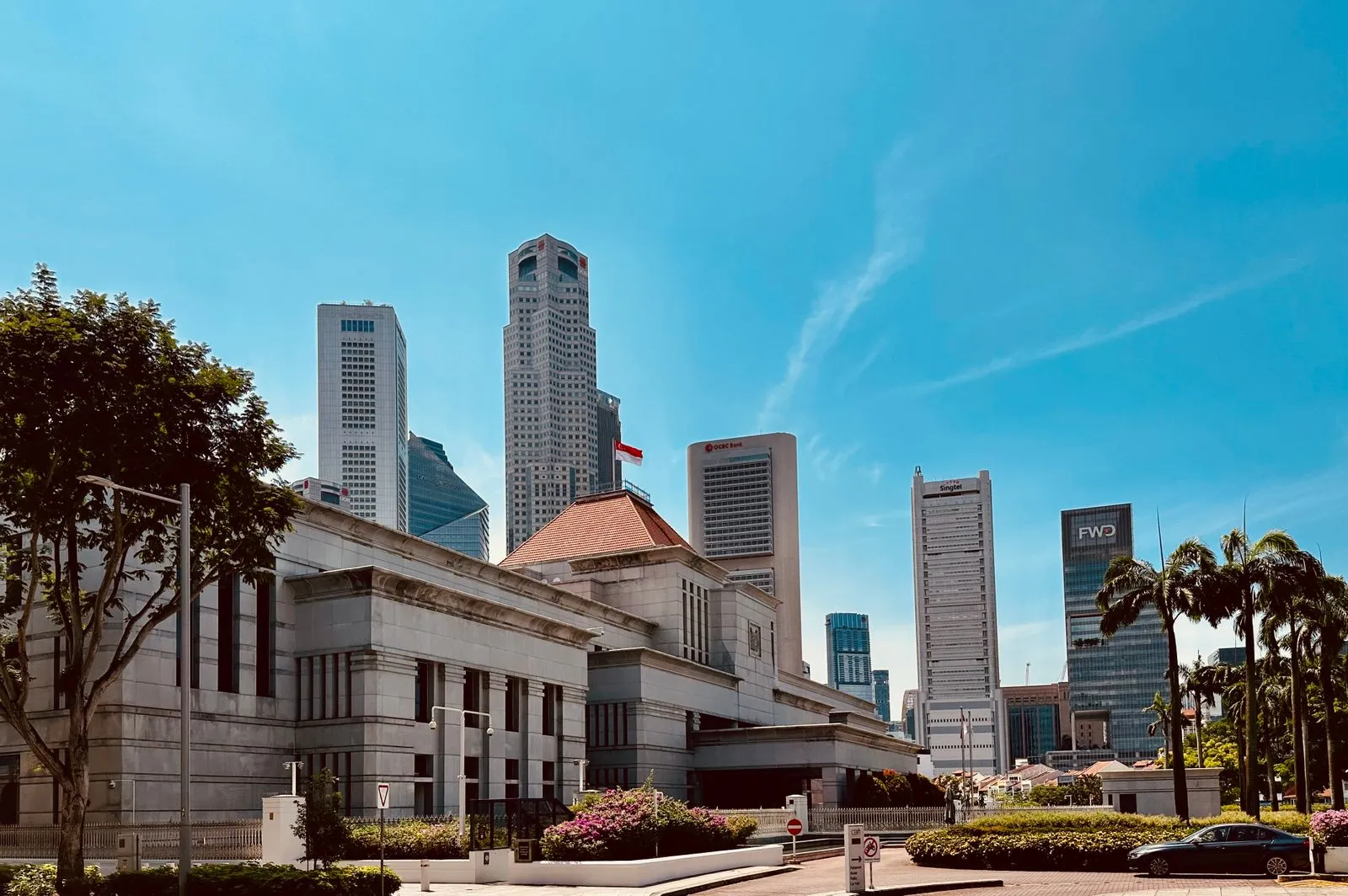 Parliament House in Singapore, with the towers of the financial district behind it.